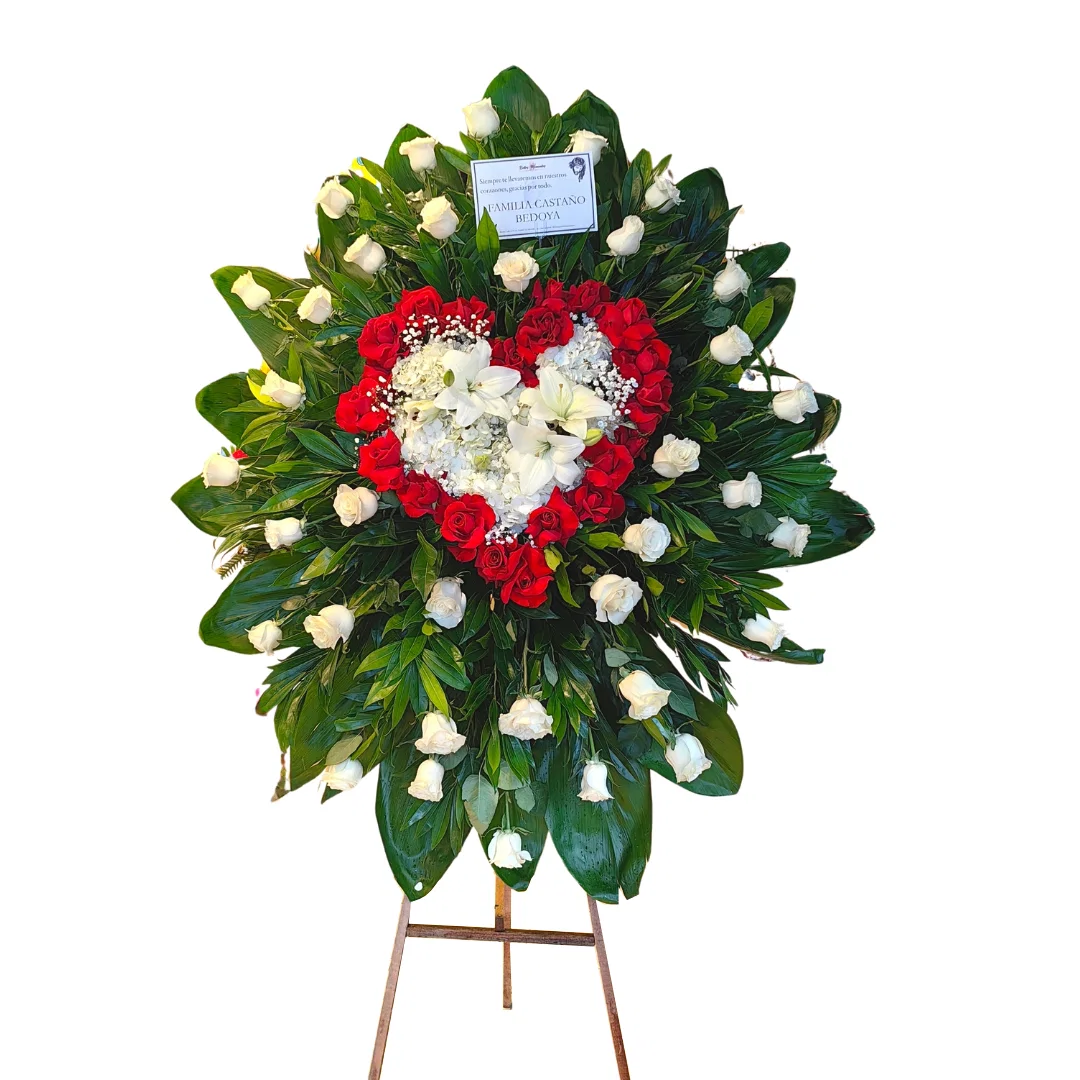 Corona floral de condolencias con corazón de rosas rojas y flores blancas